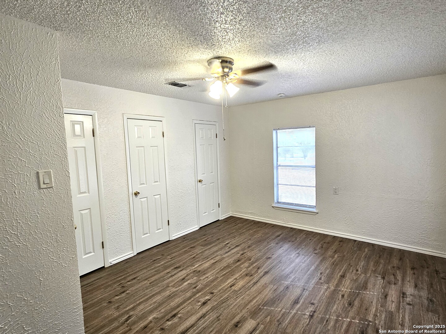 105 Santa Clara Street Cibolo, TX 78108 - Photo 26 of 35 a view of an empty room with wooden floor and a window