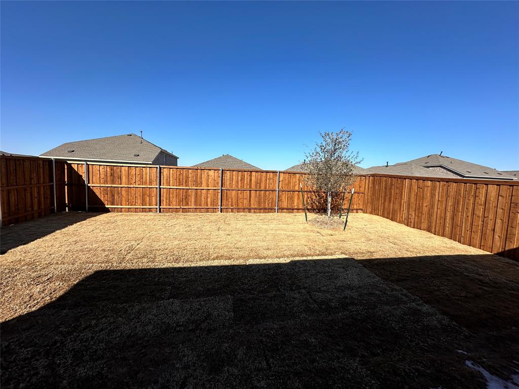 1617 Elliott Road Howe, TX 75459 - Photo 14 of 14 a view of a house with backyard and patio