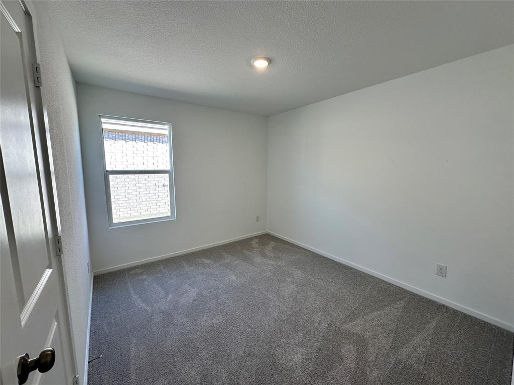 1617 Elliott Road Howe, TX 75459 - Photo 5 of 14 an empty room with a window