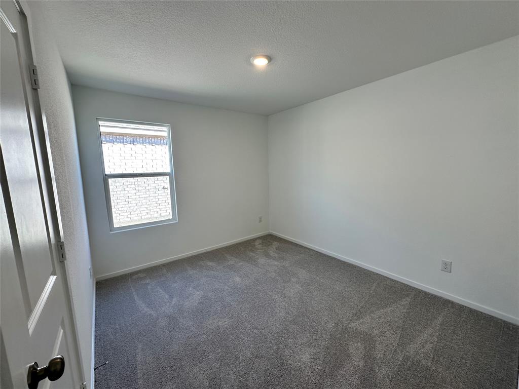 1617 Elliott Road Howe, TX 75459 - Photo 7 of 14 an empty room with a window