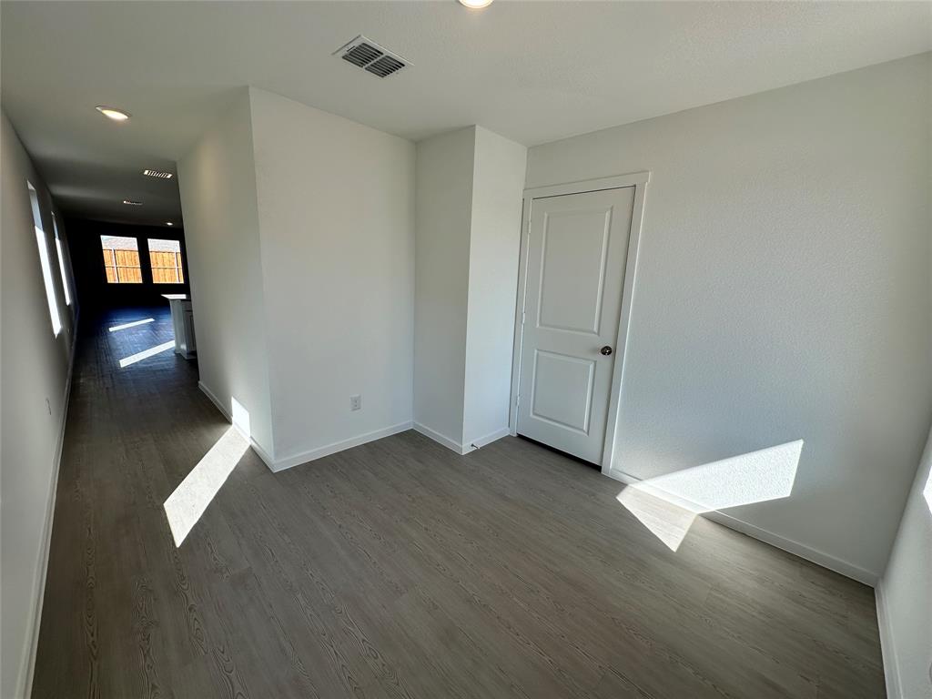1617 Elliott Road Howe, TX 75459 - Photo 8 of 14 wooden floor in an empty room with a window