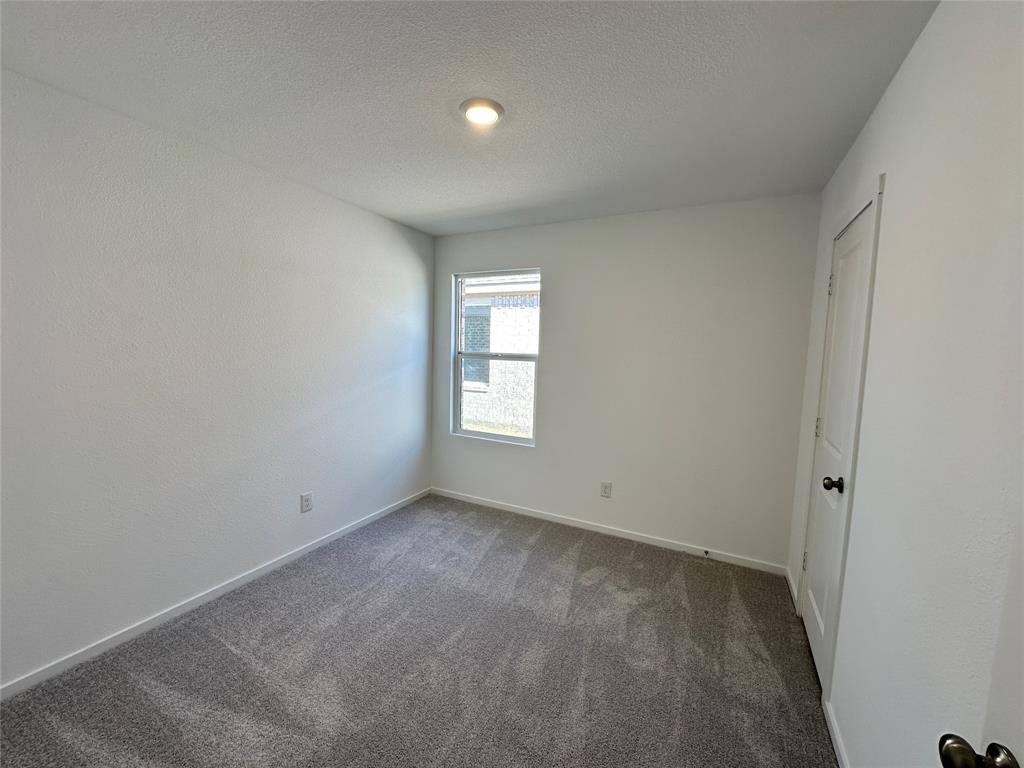 1617 Elliott Road Howe, TX 75459 - Photo 9 of 14 an empty room with a window