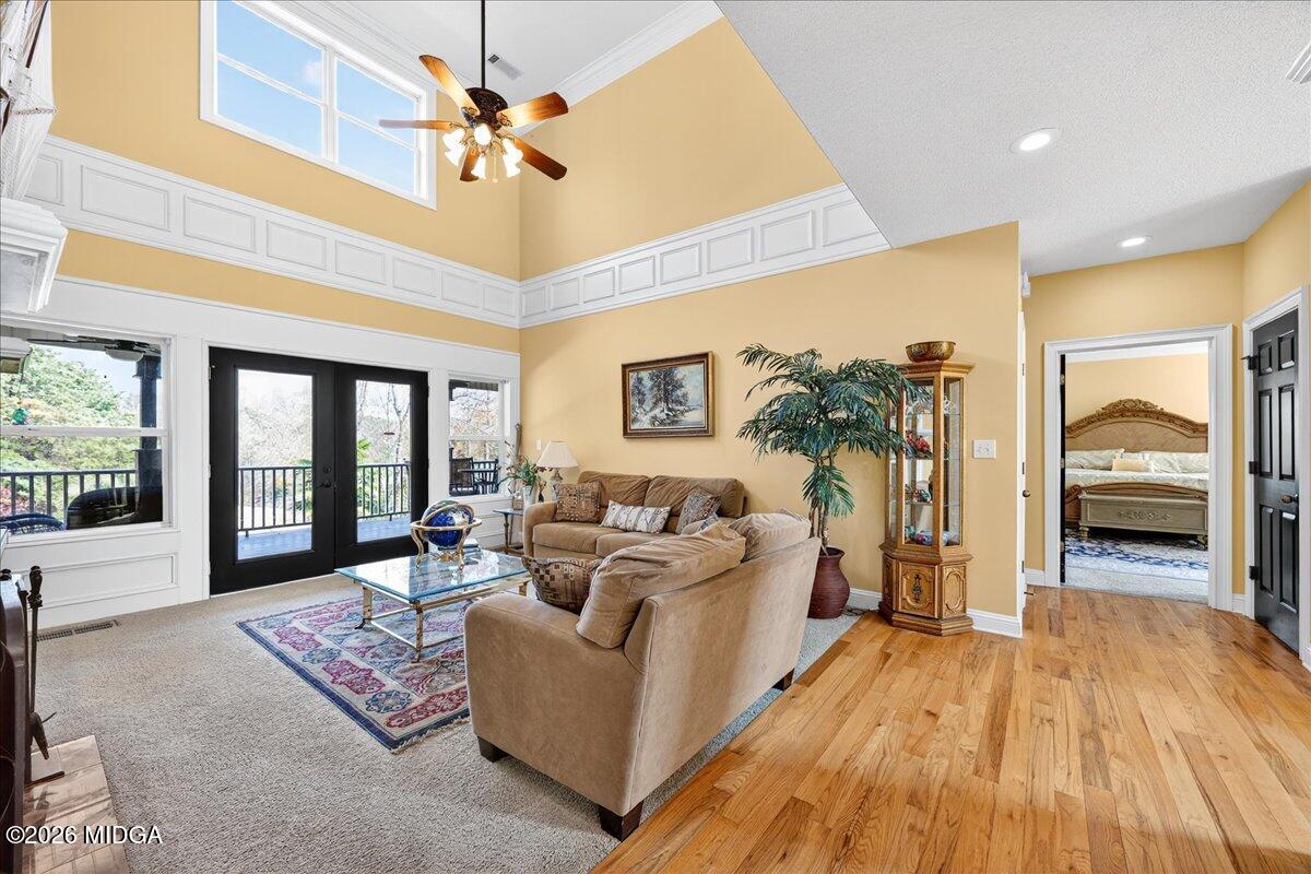 518 River Overlook Forsyth, GA 31029 - Photo 14 of 96 a living room with furniture and a floor to ceiling window