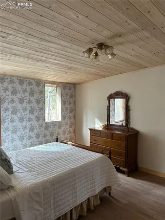 a bedroom with bed and window