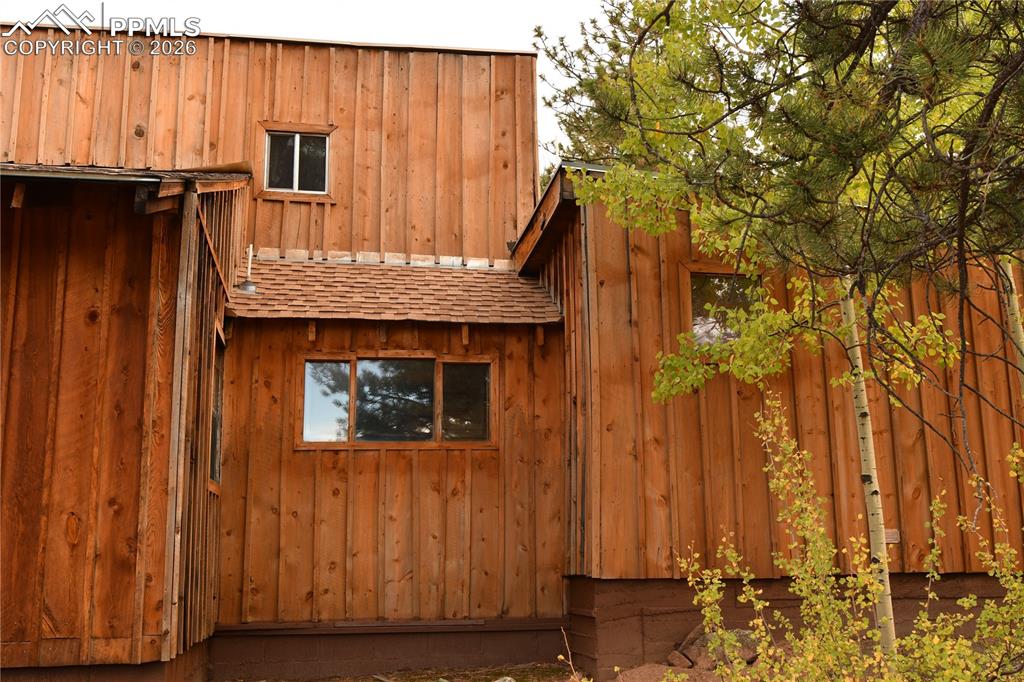 3800 Doe Valley Road Guffey, CO 80820 - Photo 3 of 43 a front view of a house with a garden