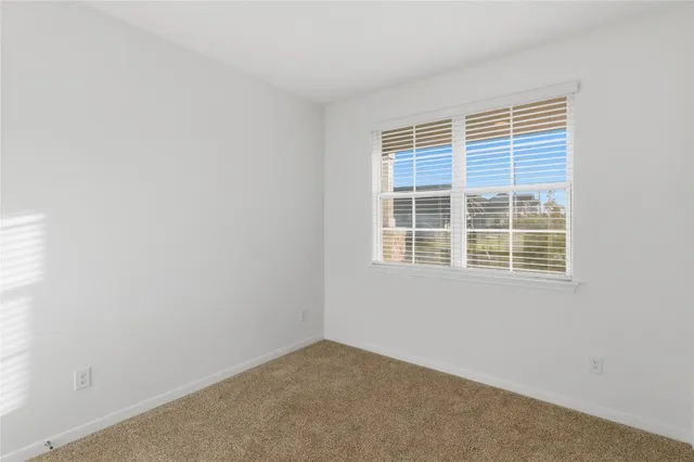 a bathroom with a shower sink and mirror
