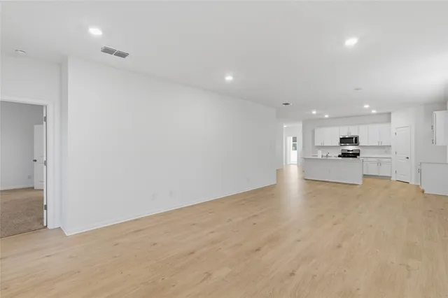 a kitchen with a sink a counter space and cabinets
