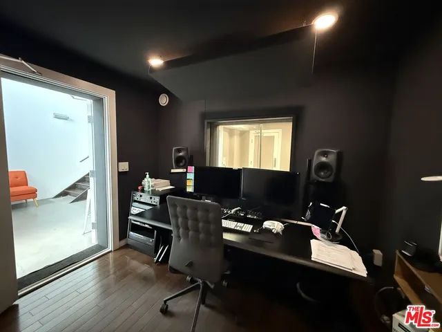 a living room with furniture and a mirror