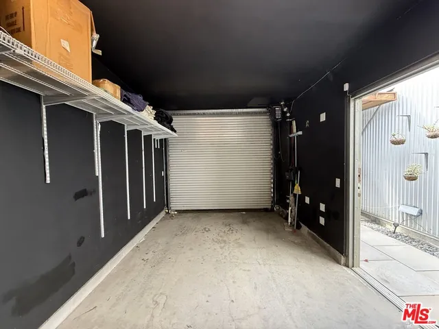 an aerial view of a house with parking space