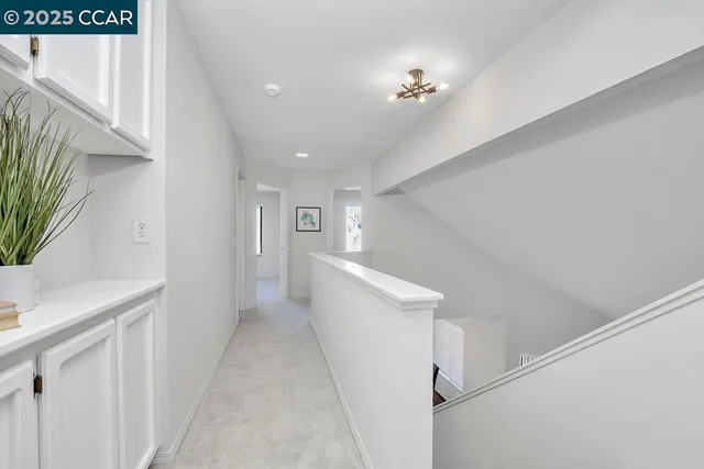 a view of a hallway with workspace