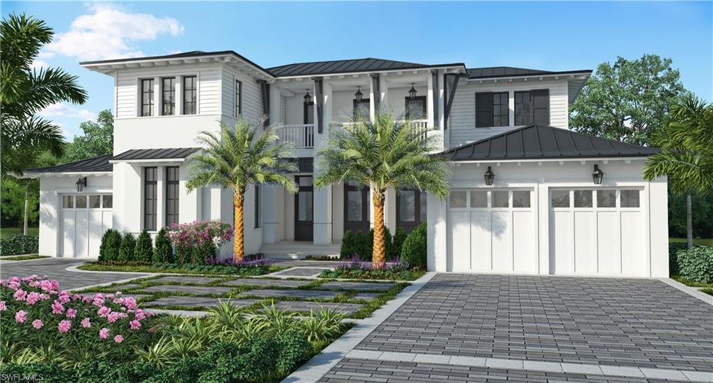 406 Rudder Road Naples, FL 34102 - Photo 1 of 3 a front view of a house with garden