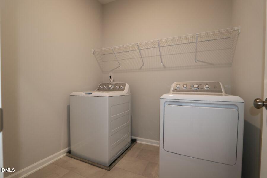 2913 Richardson Road, Unit 475 Apex, NC 27502 - Photo 16 of 24 a utility room with dryer and washer
