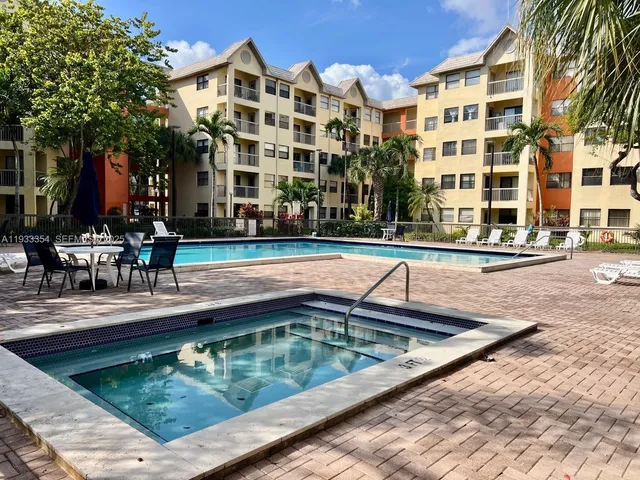 a view of a swimming pool with a lounge chairs