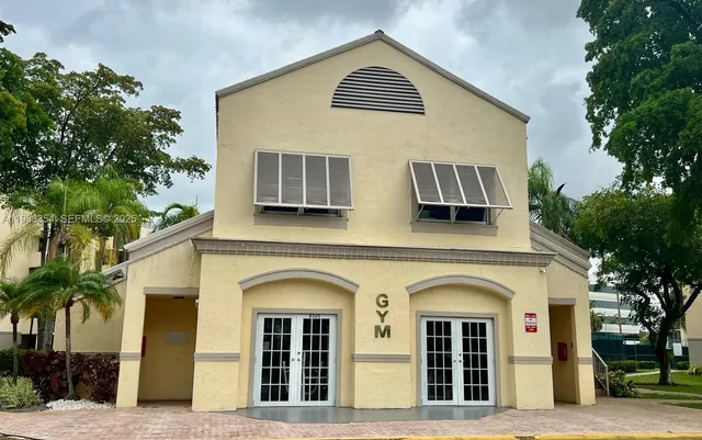 a front view of house with small garden