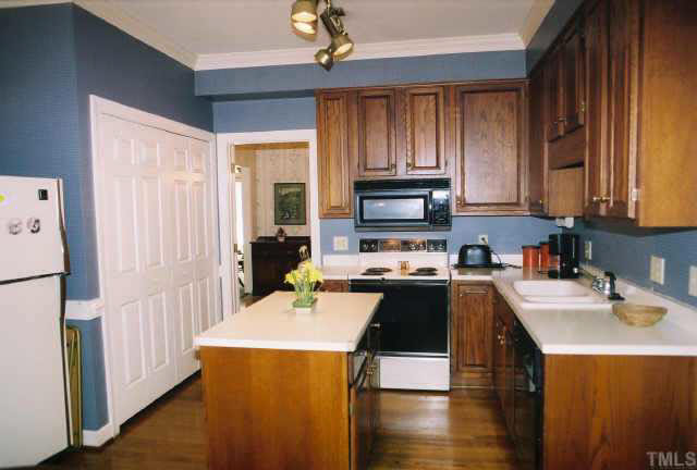 6114 Friars Walk Place Raleigh, NC 27609 - Photo 5 of 10 Eat-in kitch w/42' cabinets & island