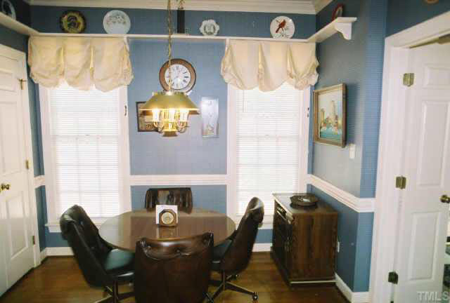 6114 Friars Walk Place Raleigh, NC 27609 - Photo 6 of 10 Kitchen nook w/crown molding & chair rail