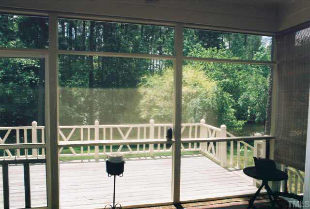 6114 Friars Walk Place Raleigh, NC 27609 - Photo 9 of 10 Screen porch overlooking wooded area