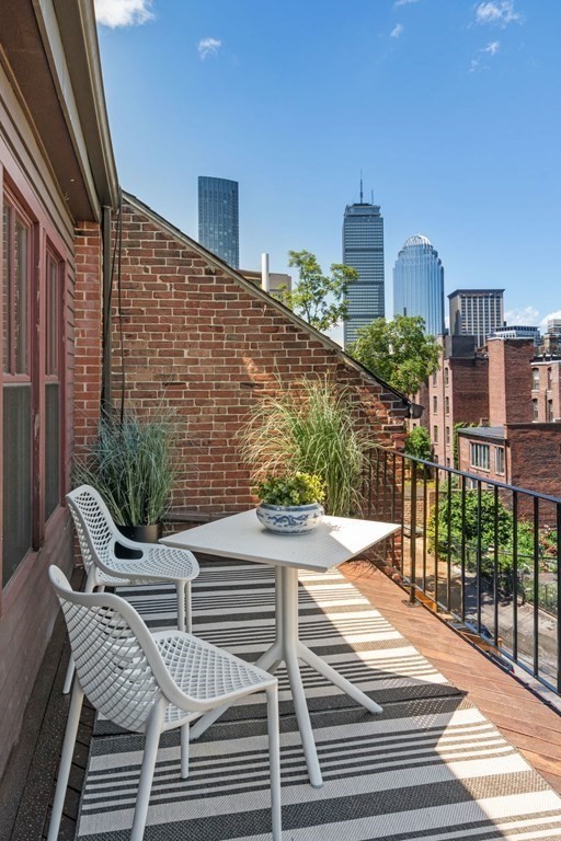 201 West Springfield Street, Unit 3 Boston, MA 02118 - Photo 13 of 21 a view of a balcony with two chairs and a potted plant