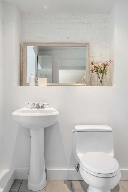 201 West Springfield Street, Unit 3 Boston, MA 02118 - Photo 16 of 21 a bathroom with a toilet sink and mirror