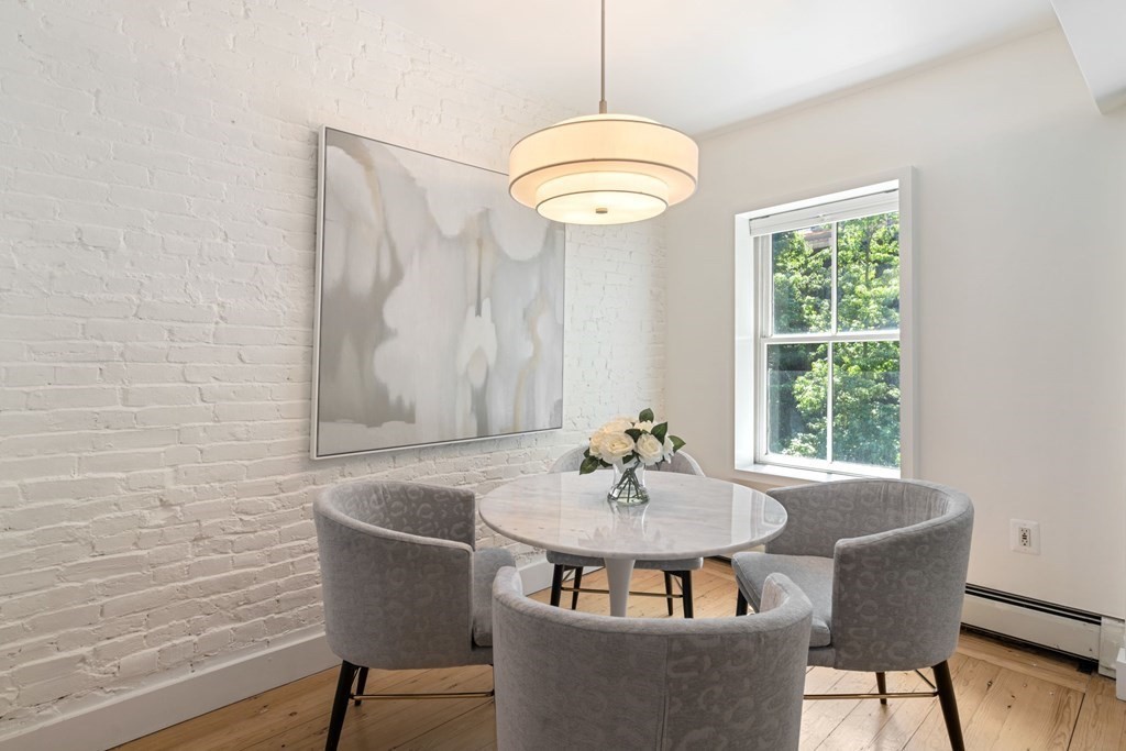201 West Springfield Street, Unit 3 Boston, MA 02118 - Photo 5 of 21 a view of a dining room with furniture window and wooden floor