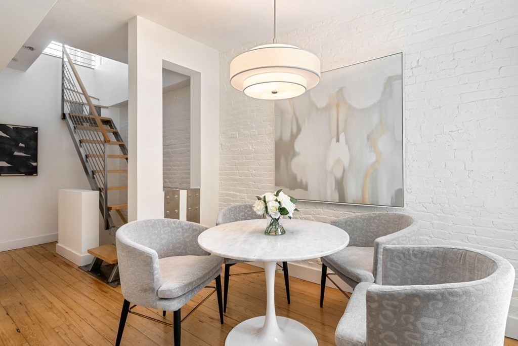201 West Springfield Street, Unit 3 Boston, MA 02118 - Photo 6 of 21 a living room with furniture and a chandelier