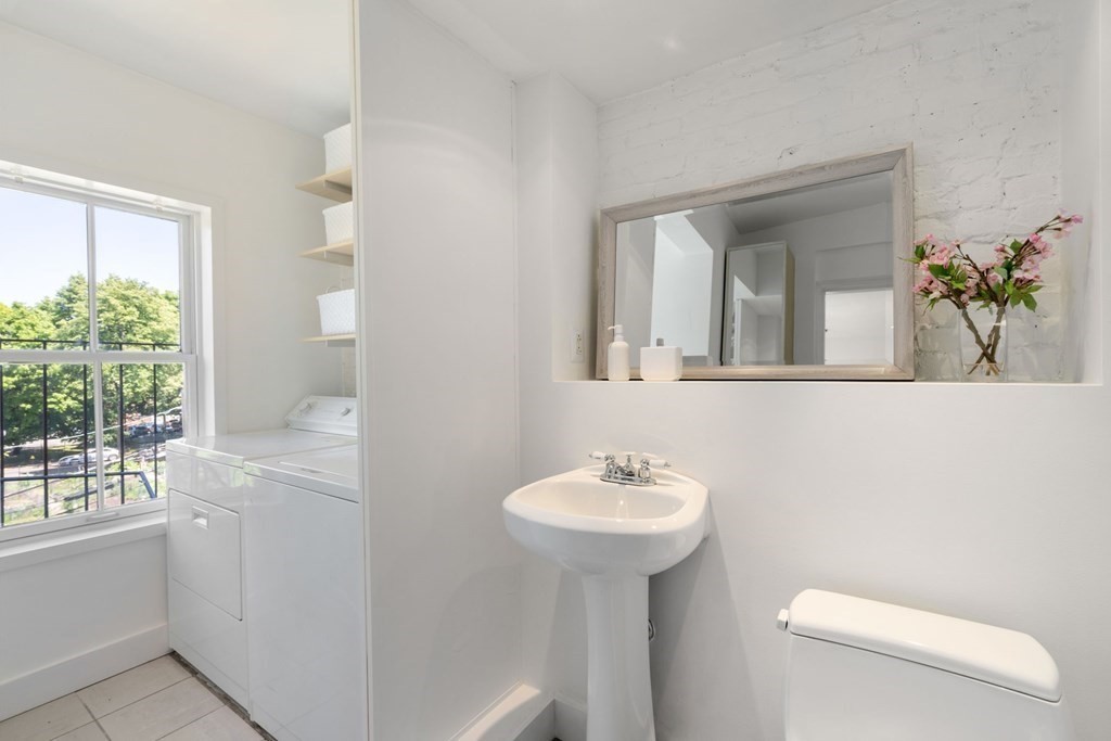 201 West Springfield Street, Unit 3 Boston, MA 02118 - Photo 10 of 21 a bathroom with a sink toilet and mirror