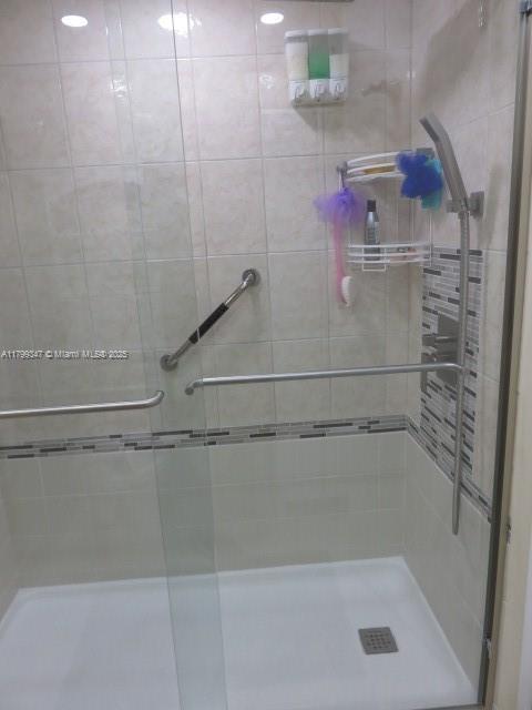 7040 Southwest 24th Street, Unit 104 Miami, FL 33155 - Photo 21 of 27 a bathroom with a shower