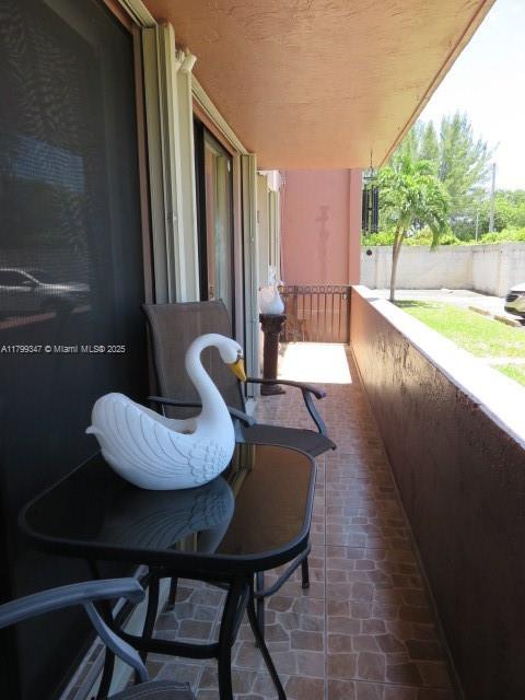 7040 Southwest 24th Street, Unit 104 Miami, FL 33155 - Photo 25 of 27 a view of a dining room with furniture and wooden floor