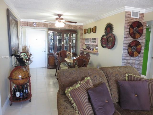 7040 Southwest 24th Street, Unit 104 Miami, FL 33155 - Photo 3 of 27 a living room with furniture and a mirror