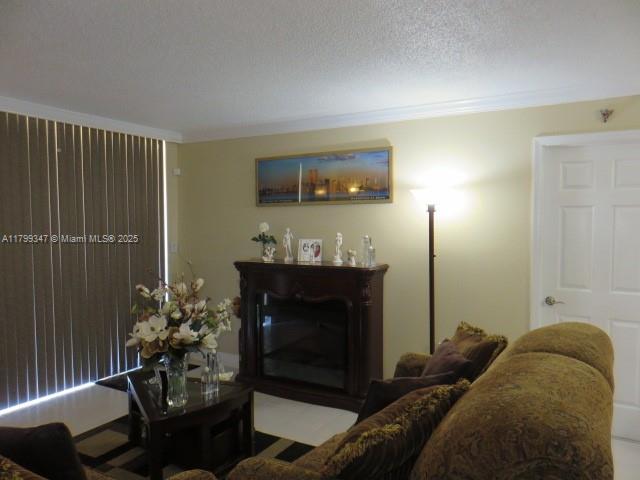 7040 Southwest 24th Street, Unit 104 Miami, FL 33155 - Photo 5 of 27 a living room with furniture and a fireplace
