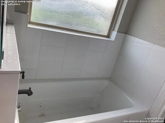 a bathroom with a bathtub