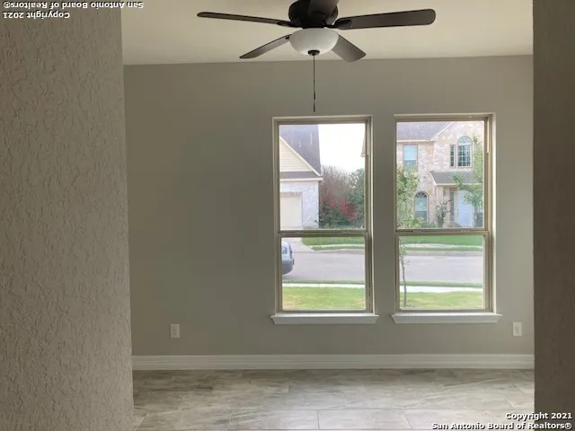 a view of an empty room with a window