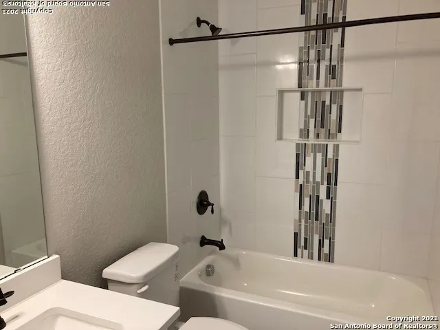 a bathroom with a toilet and a bathtub