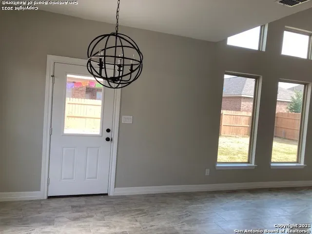 a room with window and entryway