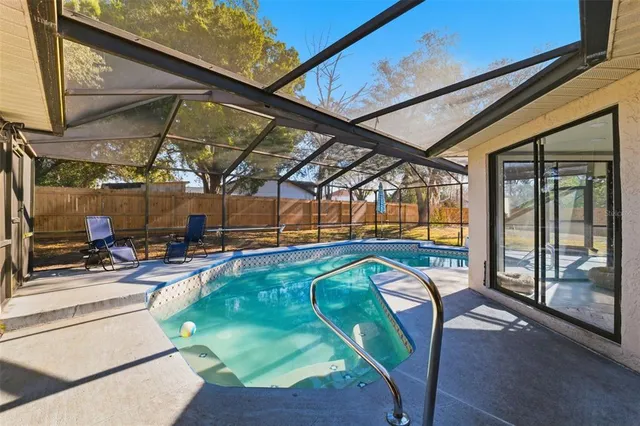 a view of a porch with furniture and floor to ceiling window