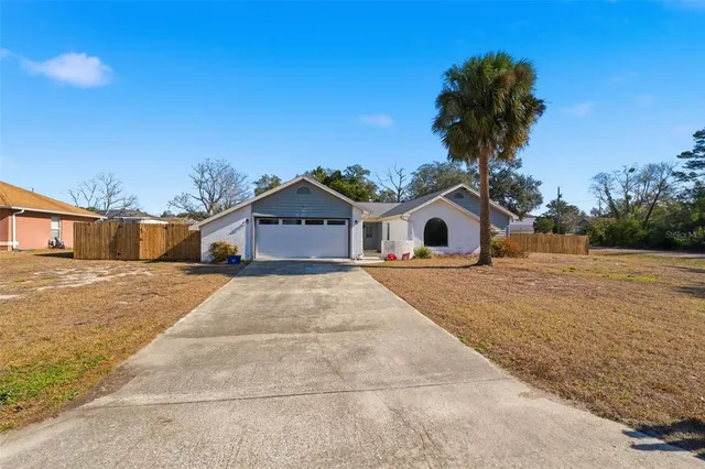 a large room with mirror and view of living room
