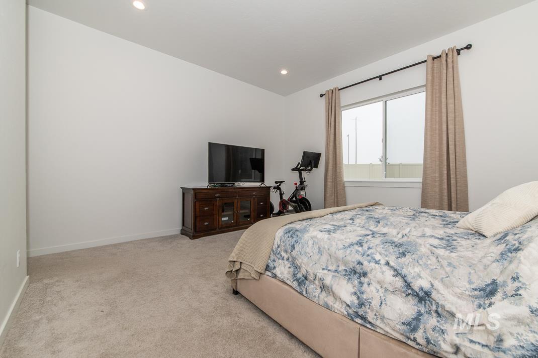 5610 Sparky Avenue Caldwell, ID 83607 - Photo 11 of 27 primary bedroom featuring carpet floors and recessed lighting