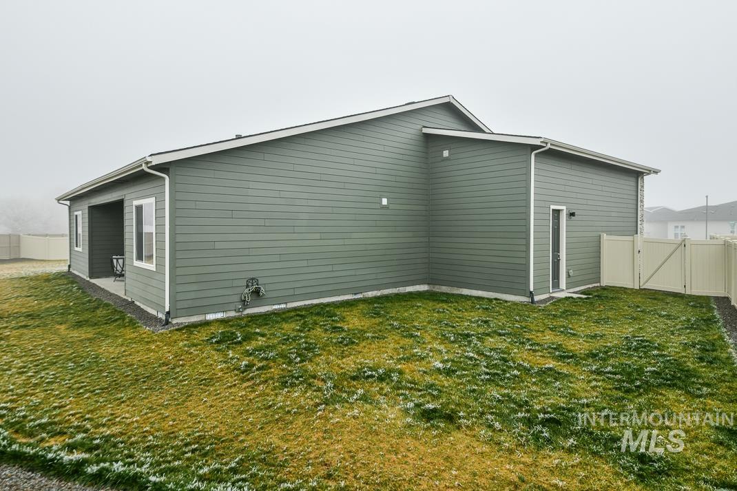 5610 Sparky Avenue Caldwell, ID 83607 - Photo 24 of 27 Rear view of house with a gate