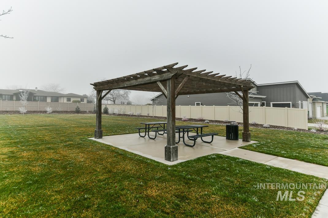5610 Sparky Avenue Caldwell, ID 83607 - Photo 26 of 27 View of community with a pergola, a patio, and a fenced backyard