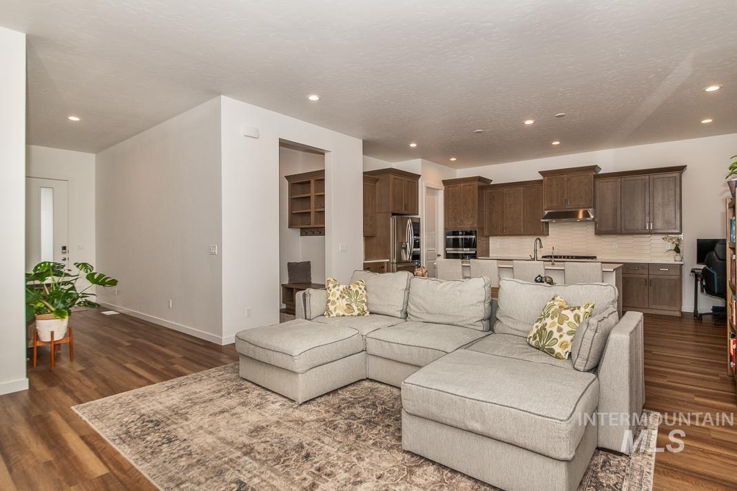 5610 Sparky Avenue Caldwell, ID 83607 - Photo 4 of 14 Living room with dark wood finished floors and recessed lighting
