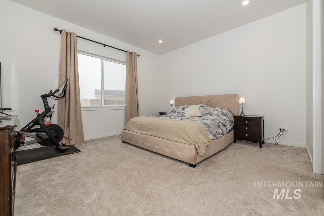 5610 Sparky Avenue Caldwell, ID 83607 - Photo 9 of 14 Carpeted bedroom featuring recessed lighting