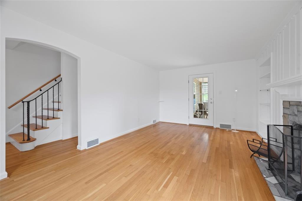 441 Old Farm Road Pittsburgh, PA 15228 - Photo 13 of 33 a view of an empty room with wooden floor and staircase