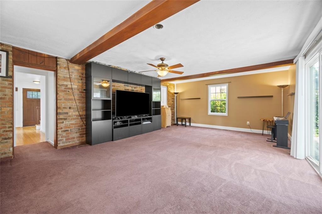 441 Old Farm Road Pittsburgh, PA 15228 - Photo 16 of 33 a view of a livingroom with a flat screen tv and windows