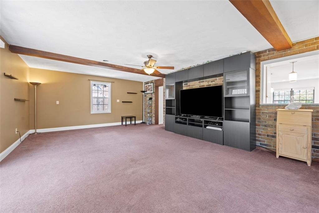 441 Old Farm Road Pittsburgh, PA 15228 - Photo 18 of 33 a living room with furniture and a flat screen tv