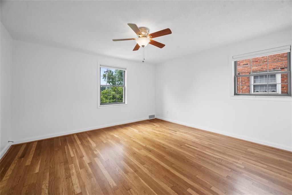 441 Old Farm Road Pittsburgh, PA 15228 - Photo 20 of 33 wooden floor in an empty room with a window