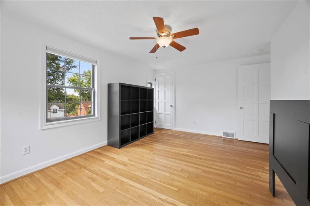441 Old Farm Road Pittsburgh, PA 15228 - Photo 23 of 33 a view of empty room with wooden floor and fan