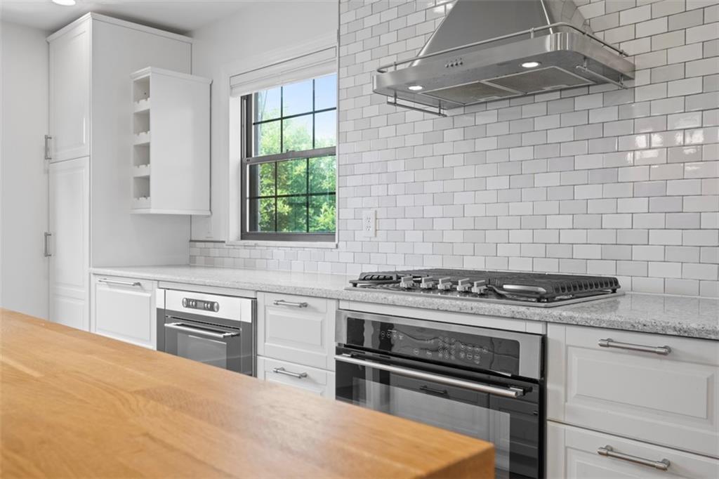 441 Old Farm Road Pittsburgh, PA 15228 - Photo 9 of 33 a kitchen with a stove a sink and a window