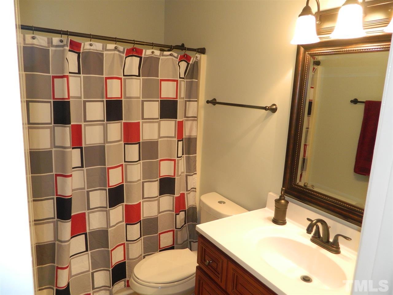 3624 Castlegate Drive Raleigh, NC 27616 - Photo 8 of 15 a bathroom with a sink toilet and shower