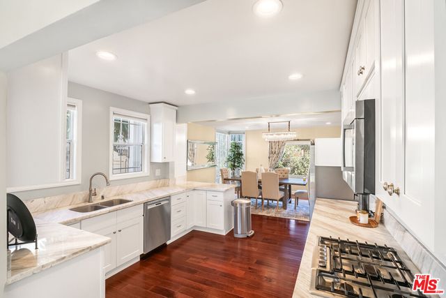 a view of a living room and entry way