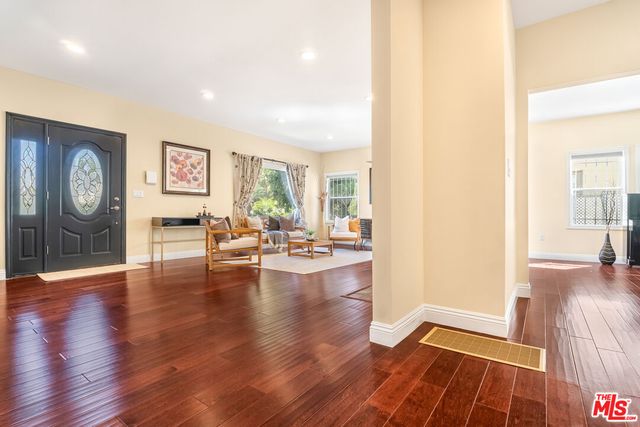a bathroom with a sink a toilet a mirror and vanity